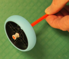 Bushing on outside of wheel to keep it from falling off.