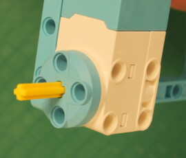 Short axle for attaching motor to wheel.